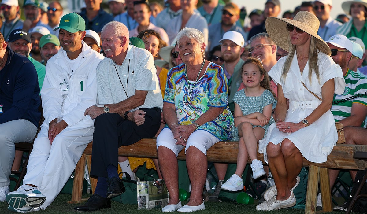 Caddie Harry Diamond, father Gerry McIlroy, mother Rosie McIlroy, daughter Poppy and wife Erica Stoll watch as Rory McIlroy (not pictured) of Northern Ireland speaks during the Green Jacket Ceremony after winning during the final round of the 2026 Masters Tournament at Augusta National Golf Club. Pic: Getty Images