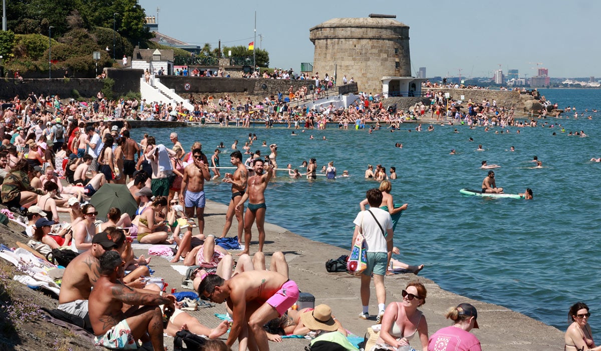 12/07/2025 Dublin Ireland. Huge crowds of people on the beach at Sea Point enjoying the good sunny weather while the heatwave continues in Ireland. Photo: Leah Farrell/© RollingNews.ie