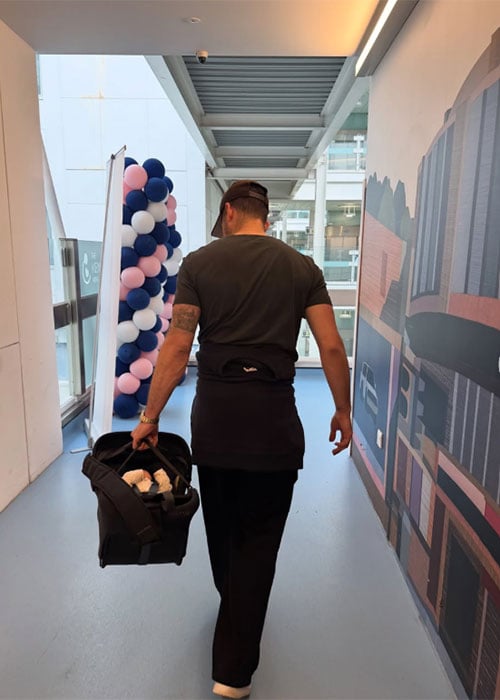 Nicola Roberts takes a picture of her fiancé Mitch Hahn leaving the hospital with their newborn. Pic: Instagram: Nicola Roberts