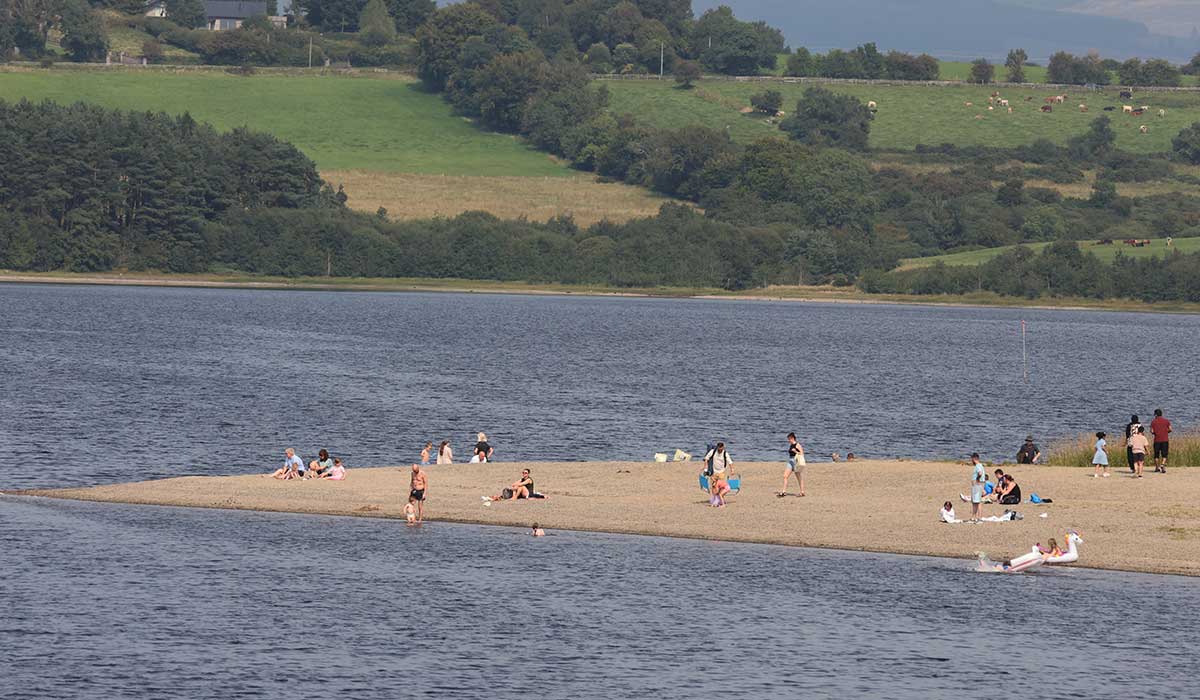 16/8/2025. Summertime On The Blessington Lakes. Wicklow, Leinster, Ireland, Irish. As Oasis take to Croke Park today, some families took to the peace and quite of the Blessington Lakes in County Wickllow today and enjoyed a taste of summer on the European mainland without the danger of wildfires. Photo shows famlies enjoying sun, sand and water on a small outcrop of beach on Blessington Lake Photo: Eamonn Farrell/ &copy; RollingNews.ie