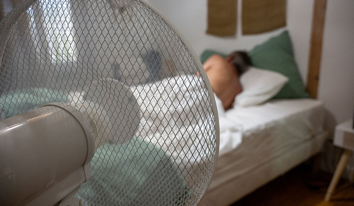 GettyImages Sleeping in heat with fan