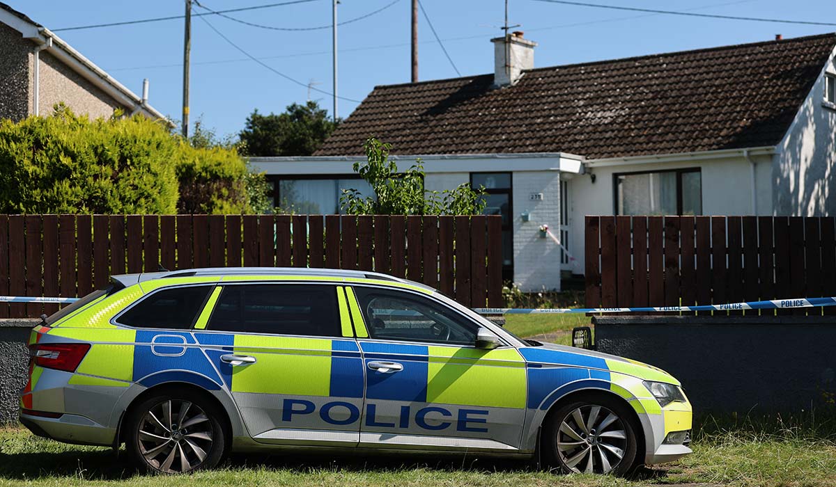 Police car at the scene in the Old Cullybackey Road area of Ballymena, County Antrim, where three people were found dead inside a property on Monday morning. Police said the three people were related, adding they don't believe there is any ongoing risk to the public as they continue their investigations. Picture date: Tuesday July 14, 2026. Pic: Liam McBurney/PA Wire