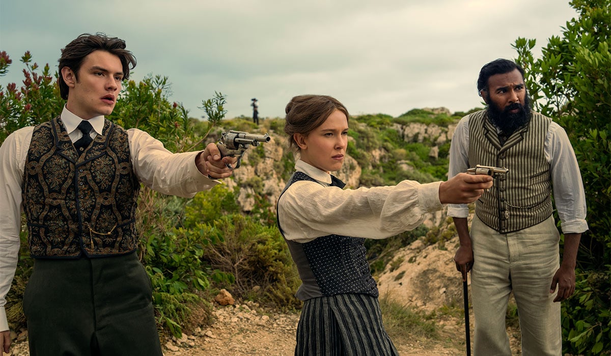 Louis Partridge as Tewkesbury, Millie Bobby Brown as Enola Holmes and Himesh Patel as Dr. Watson in Enola Holmes 3. Pic: Netflix