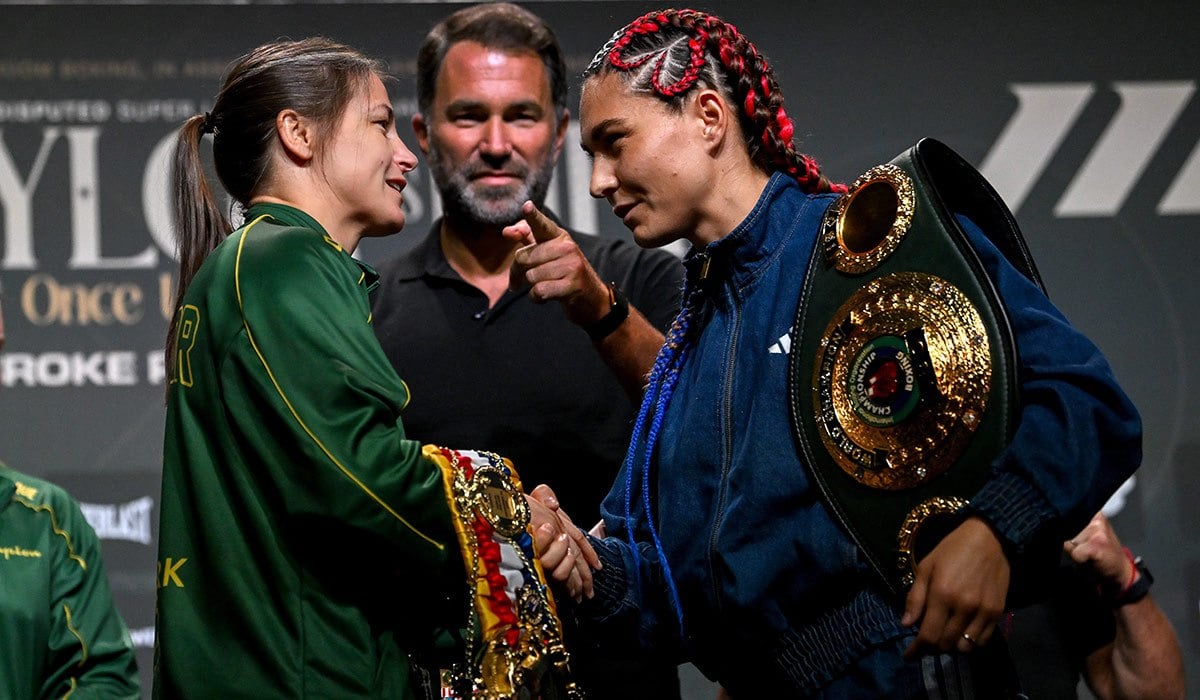 Katie Taylor and Flora Pili shake hands during a press conference. Pic: Sportsfile