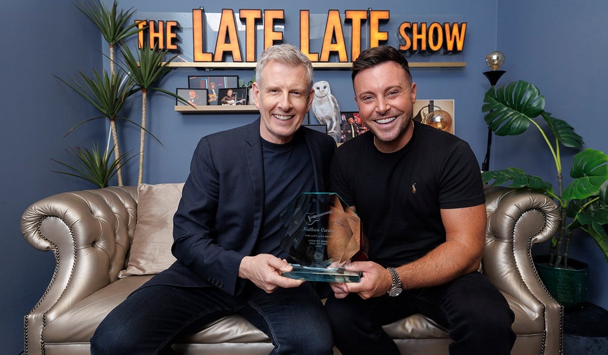 ***Embargoed until 11pm 02/10/2026***  Nathan Carter who was inducted into the Irish Country Music Hall of Fame performing a medley with the cast of the RTÉ The Late Late Country Music Special with host Patrick Kielty (left). Picture Andres Poveda