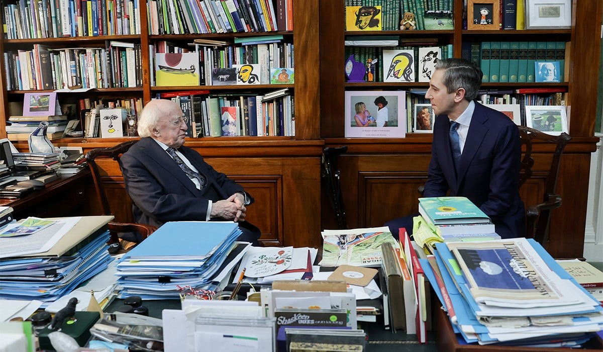 Handout photo issued by Maxwells of Irish President Michael D Higgins with Simon Harris in Aras an Uachtarain where he formally tendered his resignation as Taoiseach as part of the formalities for the first sitting of the country's newly-elected parliament. Pic: Maxwells/PA Wire