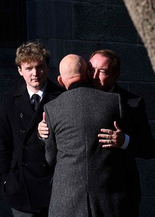 Michael Flatley (right) greets a mourner before the funeral service of his wife Niamh O'Brien at the Church Of St. Therese, Mount Merrion, near Dublin. Picture date: Saturday October 10, 2026. PA Photo. Photo credit should read: Mark Marlow/PA Wire