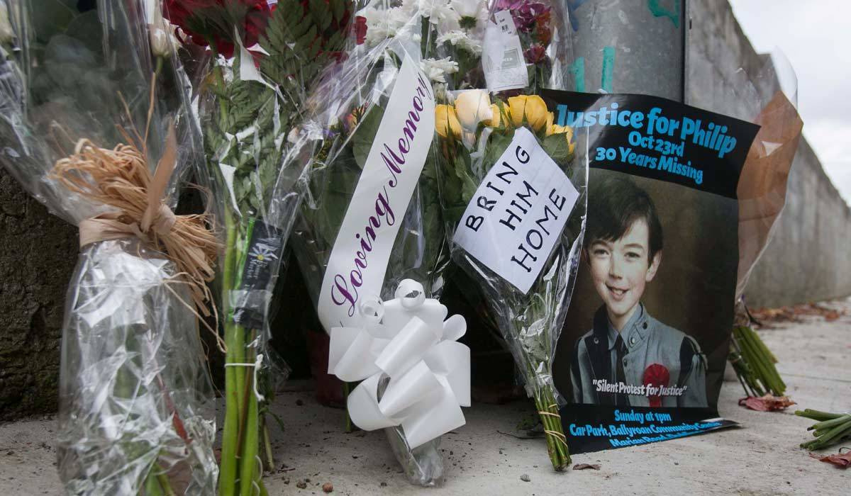 Flowers at the scene where a schoolbag belonging to Philip Cairns was found during a remembrance rally mark the 30th anniversary of his disappearance in the Ballyroan area of Rathfarnam, Dublin. The 13-year-old went missing on 23 October 1986 while making his way back to Coláiste Éanna in Rathfarnham, where he was a first-year student. Photo: Gareth Chaney Collins