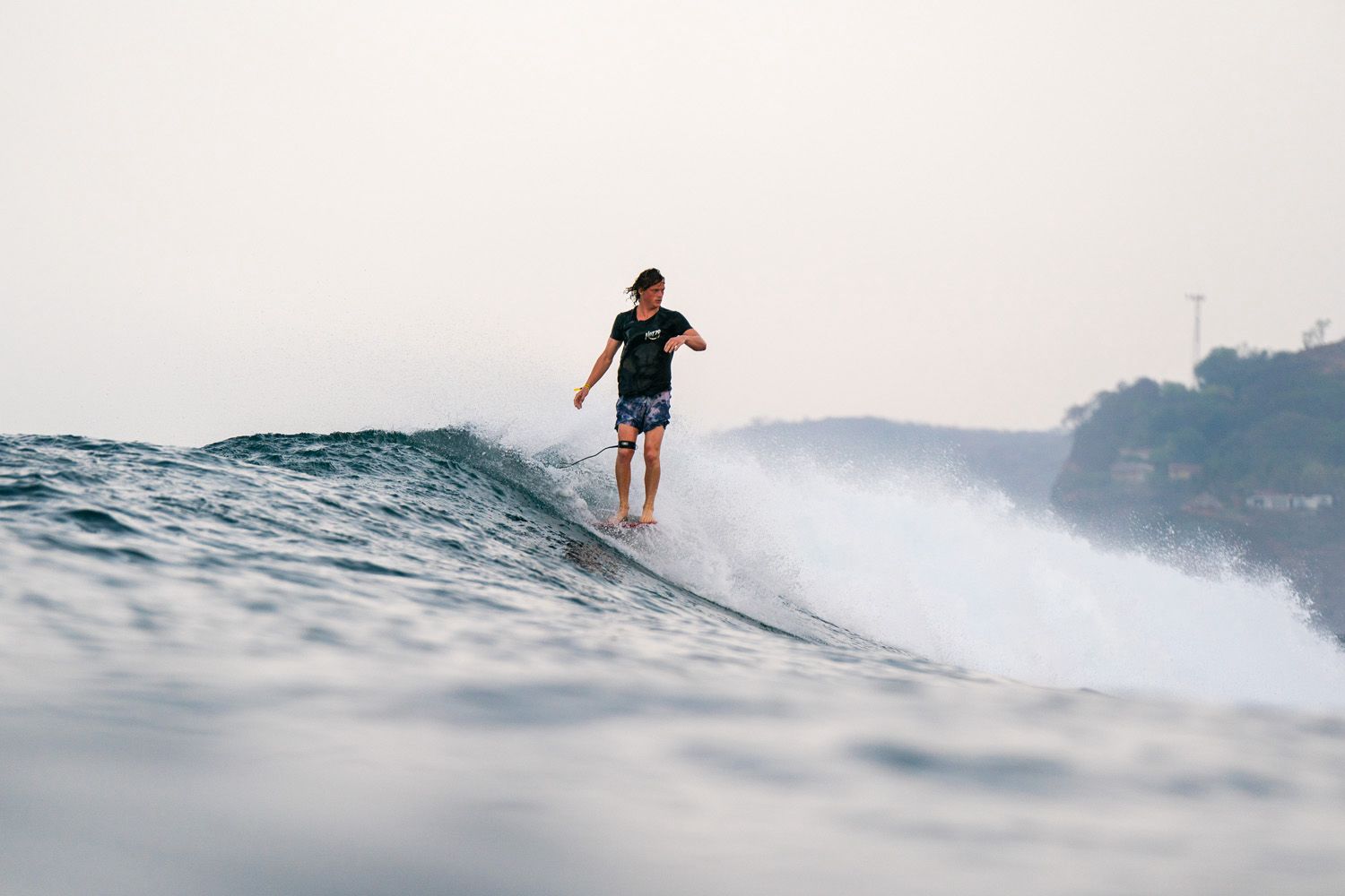 Tom Breen riding the waves in El Salvador